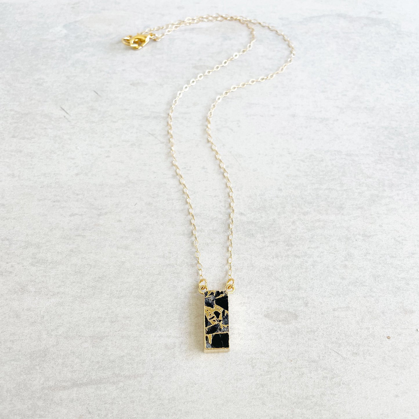 Black Mojave Vertical Bar Necklace in Gold